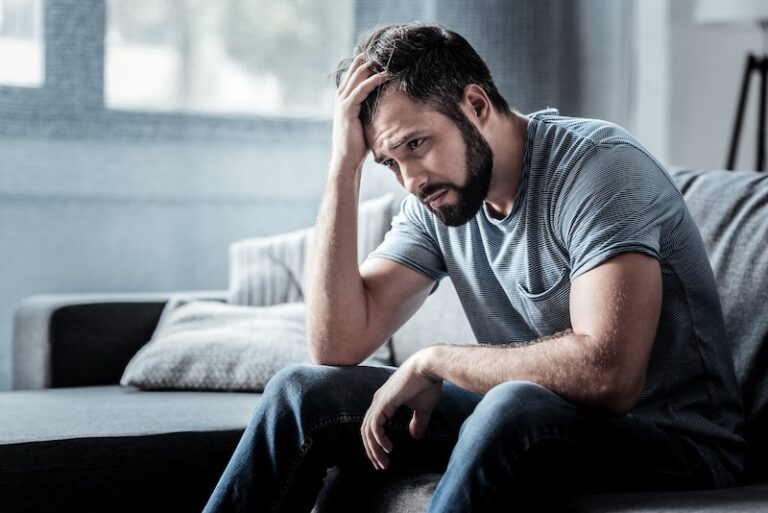 depressed man on the couch